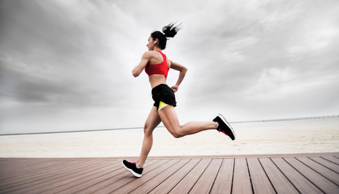 Woman running on the boardwalk