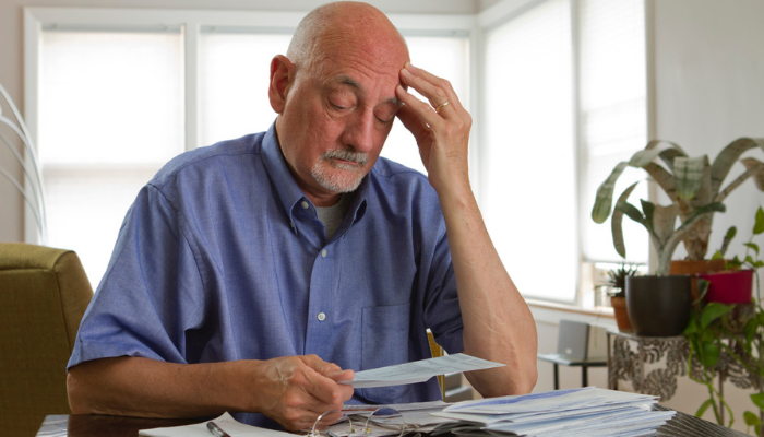 Man looking at medicare paperwork