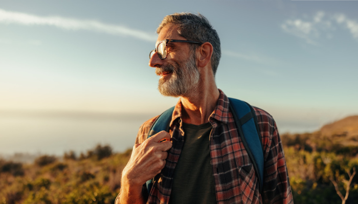 Happy senior man exploring the great outdoors.